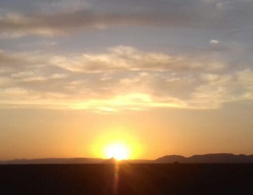 Sunset over the Sahara Desert dunes in Erg Chegaga Morocco